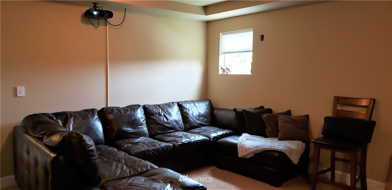 17834 Kenworth Lane Southwest Rochester, WA 98579 - Photo 11 of 29 a living room with furniture and a window
