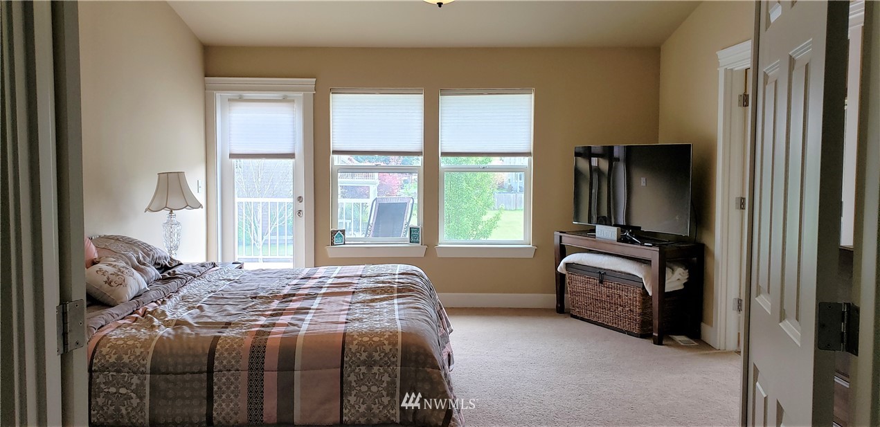 17834 Kenworth Lane Southwest Rochester, WA 98579 - Photo 14 of 29 a bedroom with a bed and a window