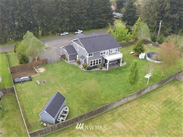 17834 Kenworth Lane Southwest Rochester, WA 98579 - Photo 3 of 29 an aerial view of a house with swimming pool garden view and trees