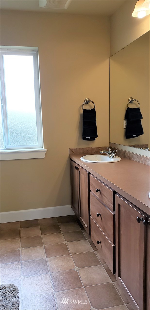 17834 Kenworth Lane Southwest Rochester, WA 98579 - Photo 21 of 29 a bathroom with a sink and a vanity