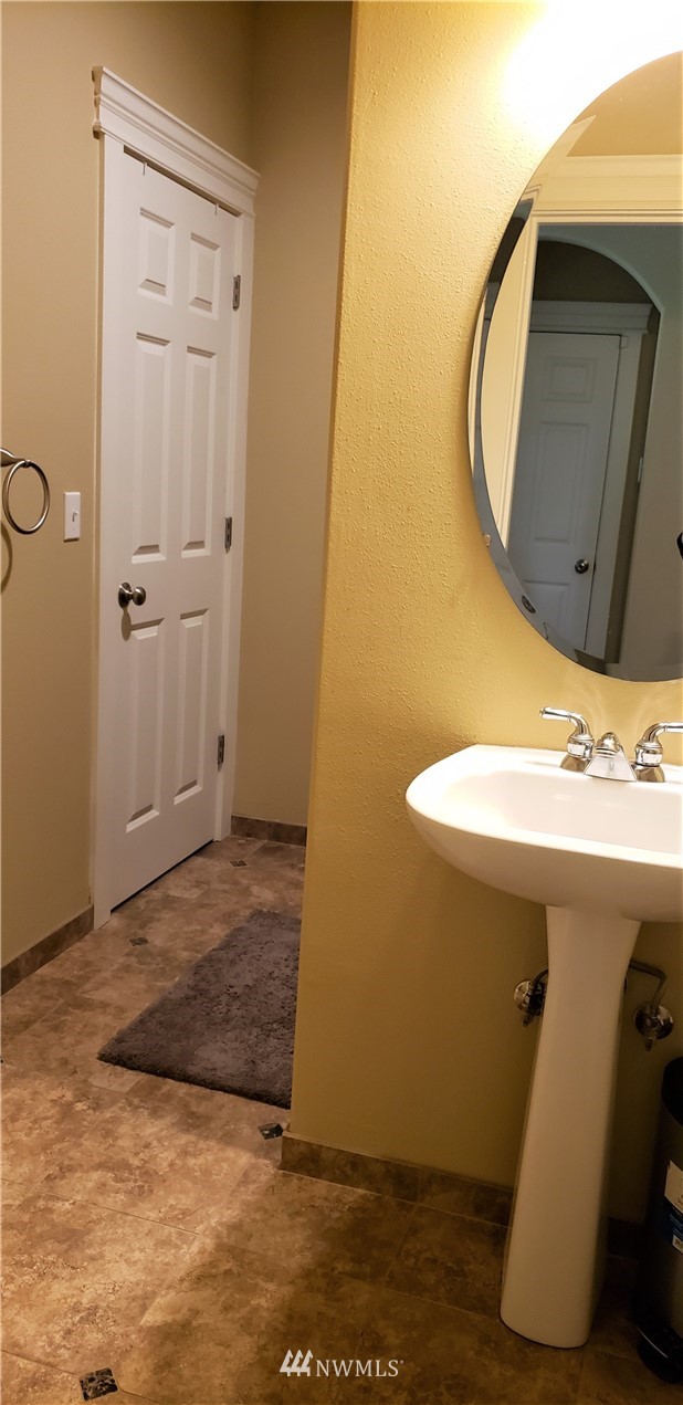 17834 Kenworth Lane Southwest Rochester, WA 98579 - Photo 24 of 29 a bathroom with a sink and a mirror