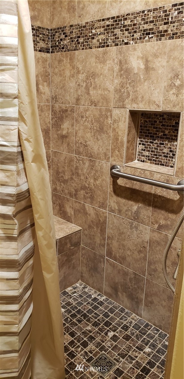17834 Kenworth Lane Southwest Rochester, WA 98579 - Photo 25 of 29 a bathroom with a shower