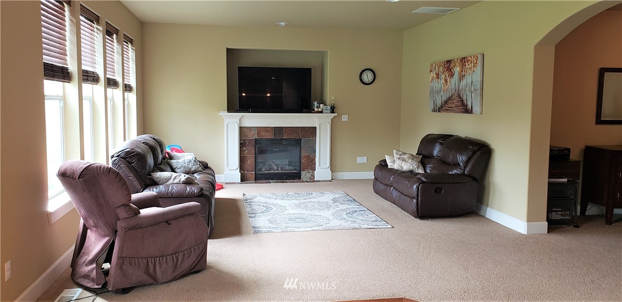 17834 Kenworth Lane Southwest Rochester, WA 98579 - Photo 8 of 29 a living room with furniture and a fireplace