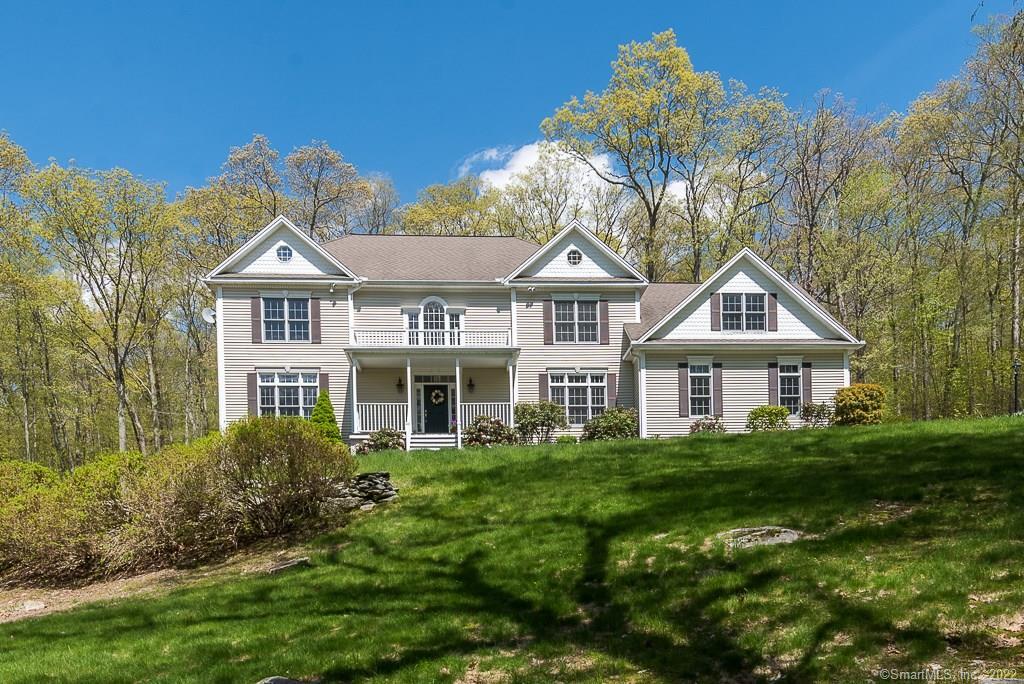 Gorgeous Custom Colonial on 4 plus acres in private country setting.