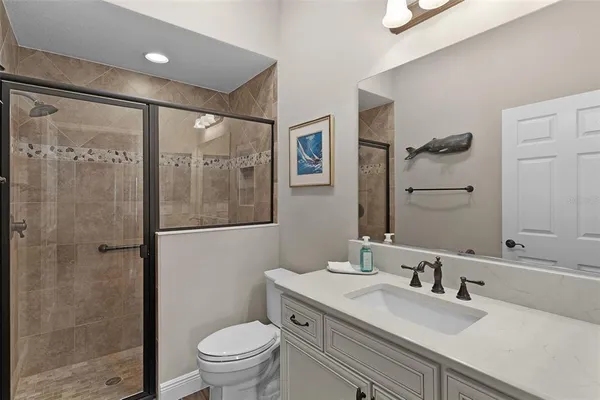 a very nice looking room with a large window and chandelier