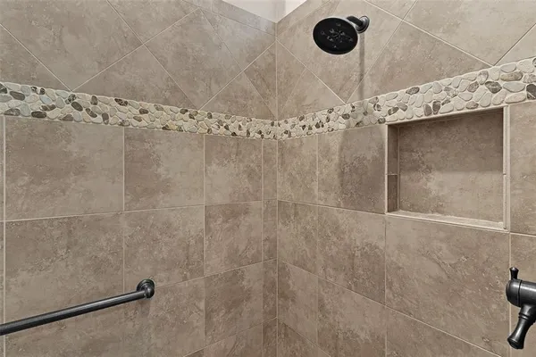 a view of a lake with houses in the back