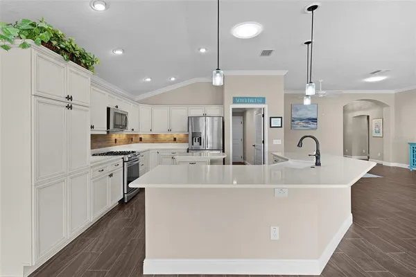 an aerial view of residential houses with outdoor space and river