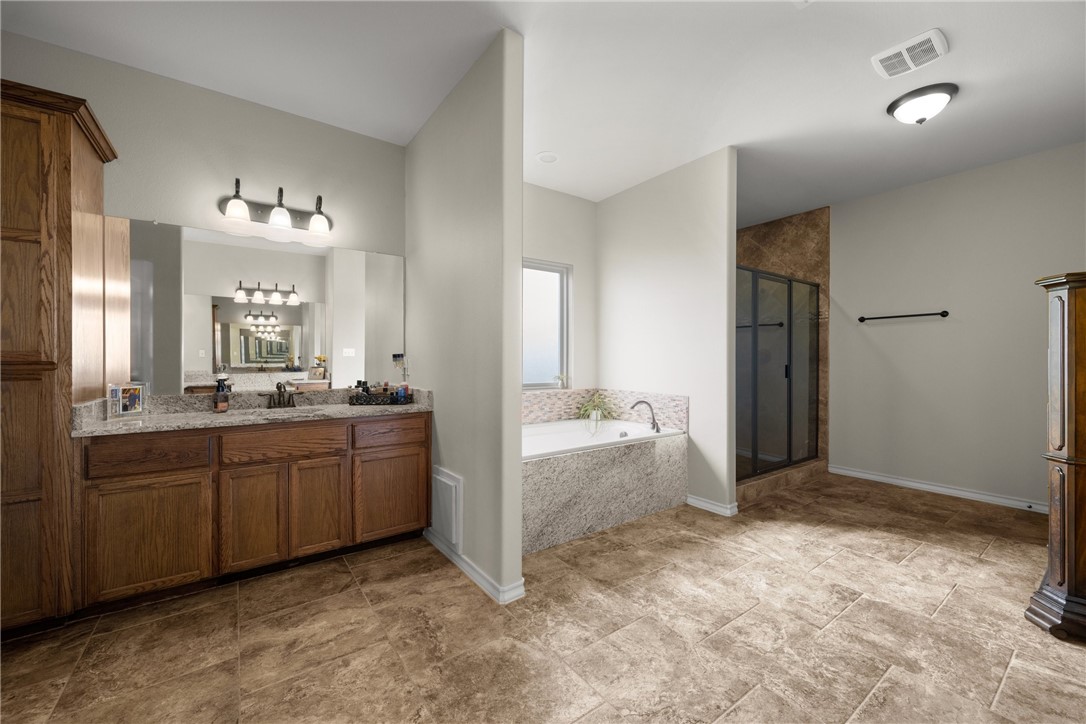 5310 Capernaum Court Corpus Christi, TX 78413 - Photo 17 of 40 a bathroom with a sink and a mirror