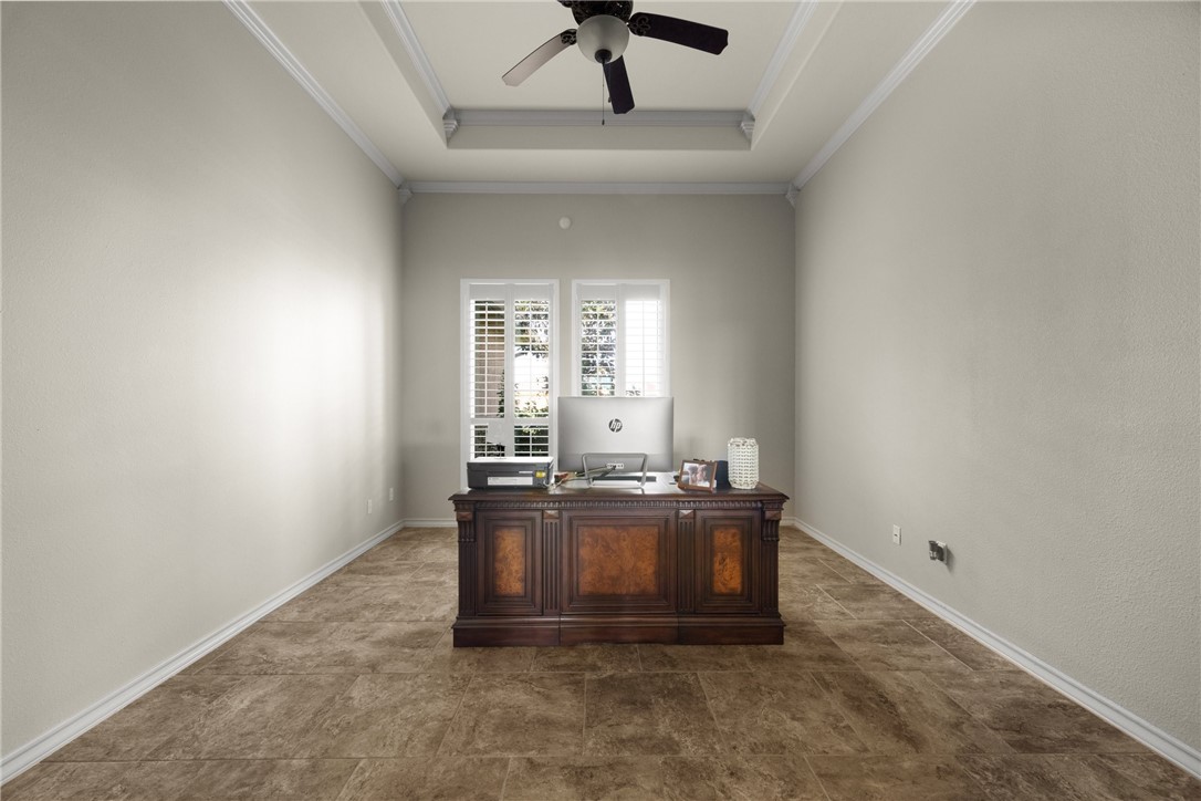 5310 Capernaum Court Corpus Christi, TX 78413 - Photo 20 of 40 an empty room with chandelier fan and windows