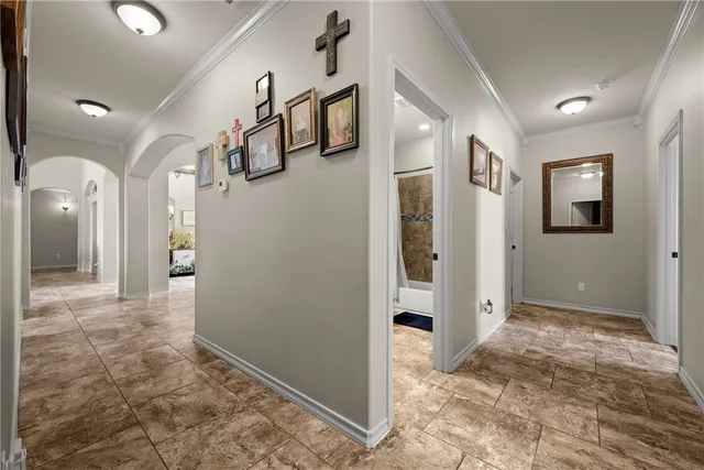 a view of a hallway with closet and bathroom