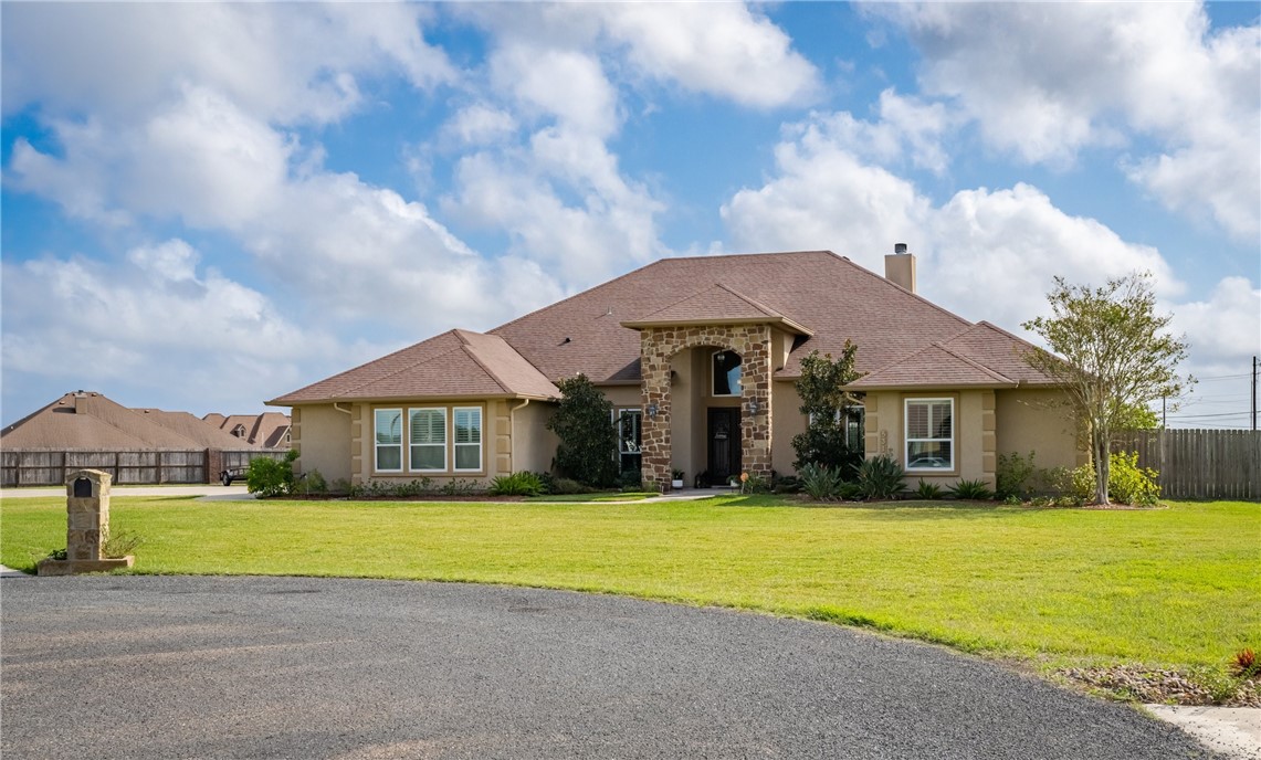5310 Capernaum Court Corpus Christi, TX 78413 - Photo 3 of 40 a view of a house with a big yard and large trees
