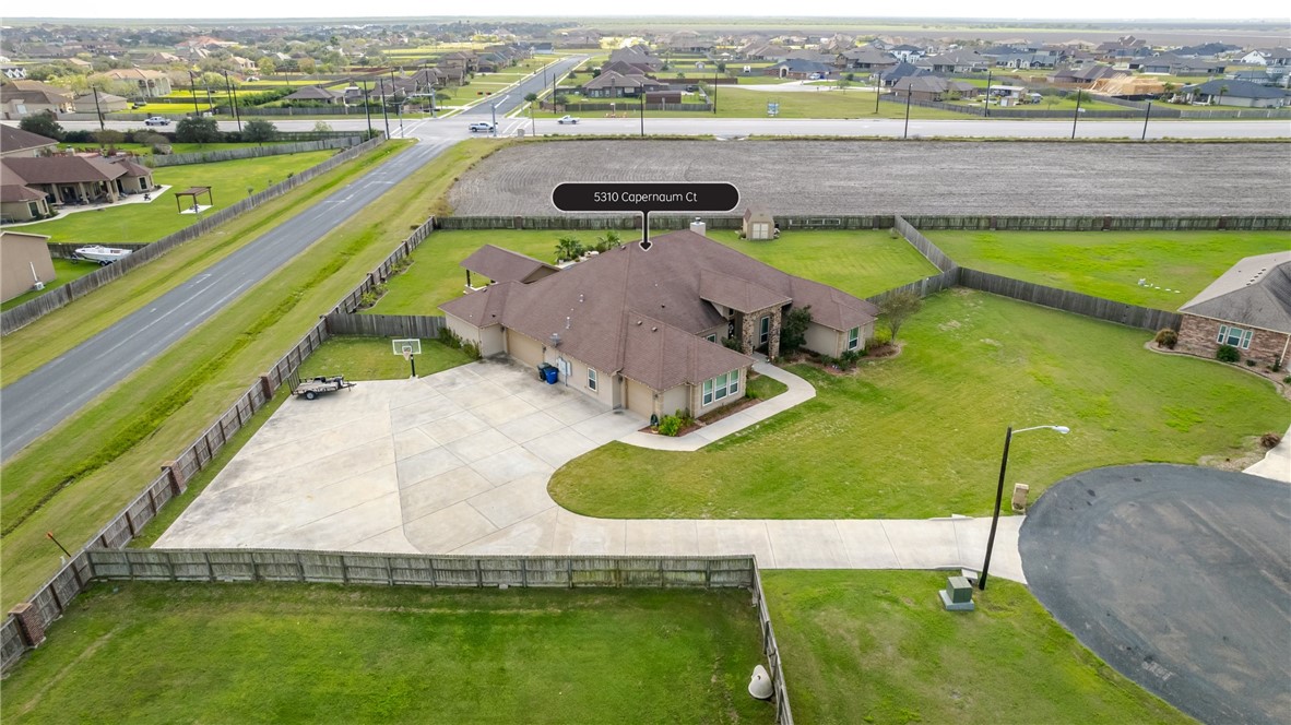 5310 Capernaum Court Corpus Christi, TX 78413 - Photo 40 of 40 an aerial view of a swimming pool with a garden and lake view