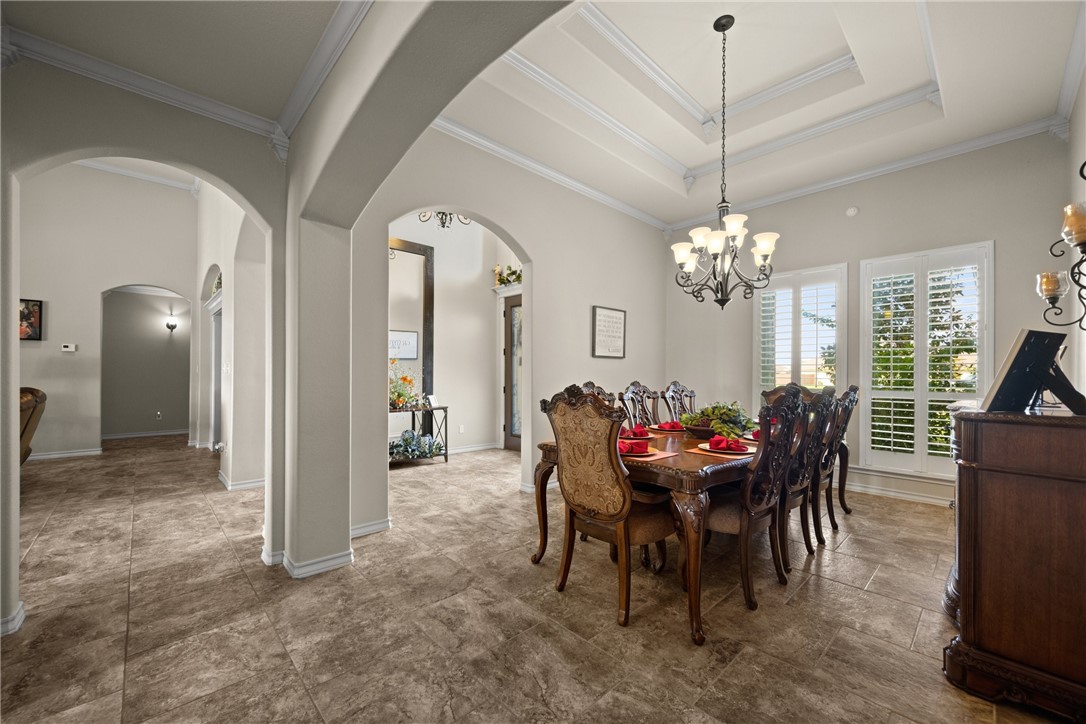 5310 Capernaum Court Corpus Christi, TX 78413 - Photo 5 of 40 a view of a dining room with furniture and chandelier