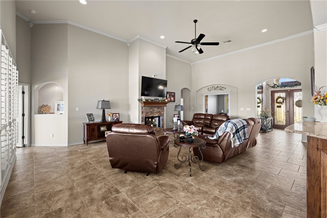 5310 Capernaum Court Corpus Christi, TX 78413 - Photo 7 of 40 a living room with furniture and a flat screen tv