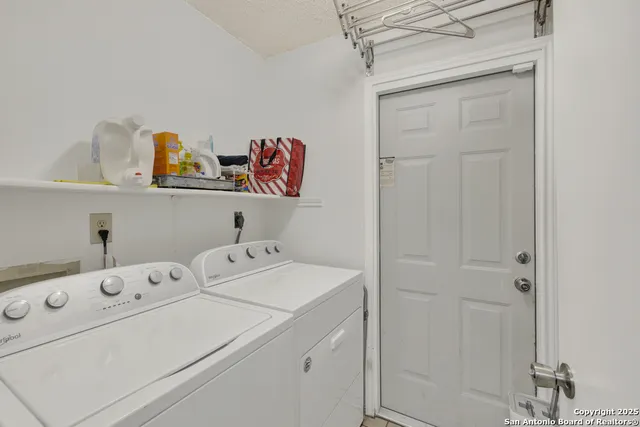 a utility room with dryer and washer