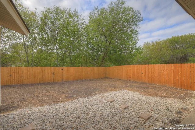 a view of backyard with green space