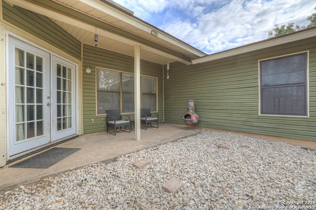 a view of a house with a backyard