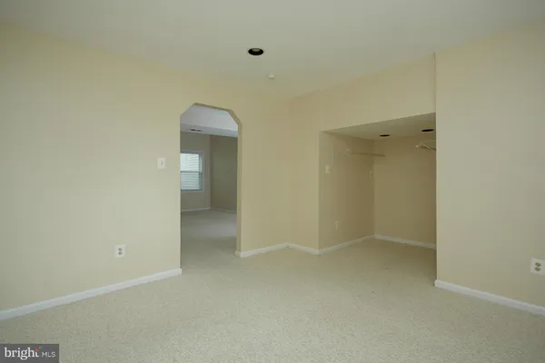 a view of empty room with floor to ceiling window