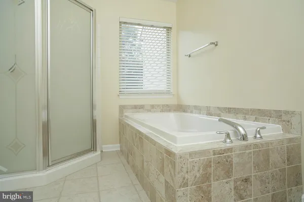 a bath tub sitting next to a window