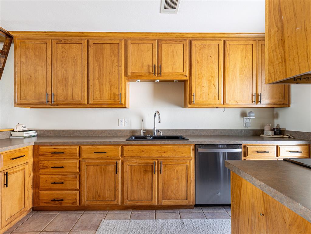 9999 Boat Club Road, Unit 601 Fort Worth, TX 76179 - Photo 10 of 39 Spacious kitchen filled with natural light and peaceful views of Eagle Mountain Lake.