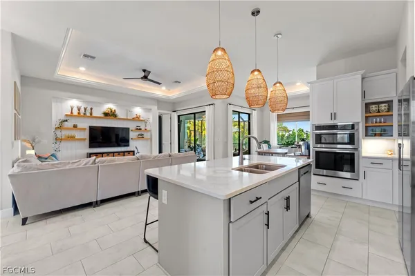 a kitchen with cabinets and window