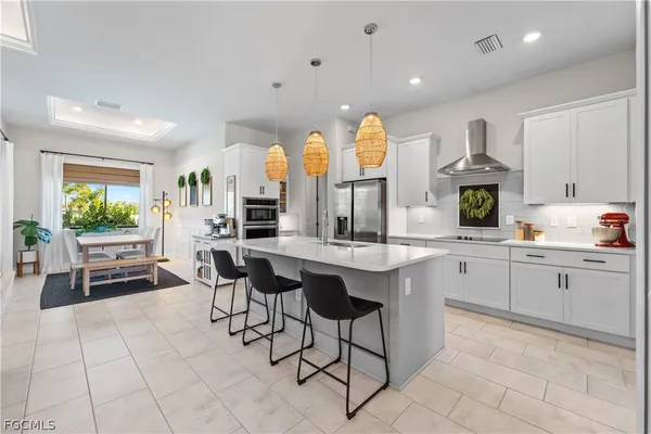 a kitchen with a sink cabinets and refrigerator