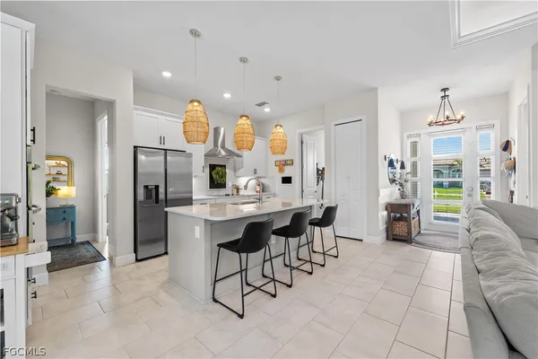 a kitchen with a table and chairs in it