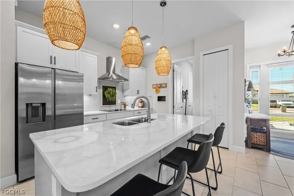 a kitchen with a sink cabinets and a window