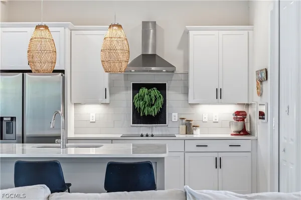 a living room with furniture a flat screen tv and a window