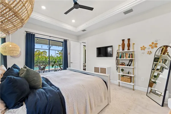 a bedroom with a bed and a flat tv screen