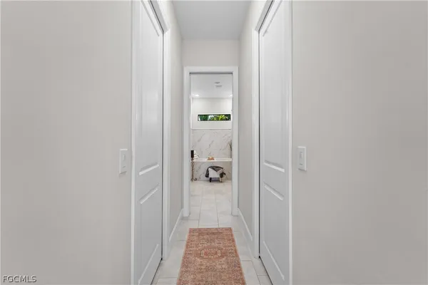 a bathroom with a sink a large mirror and a bathtub