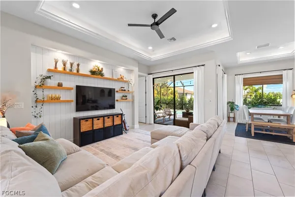 a livingroom with workspace and a window