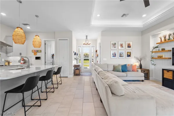 a bathroom with a granite countertop sink mirror and bathtub