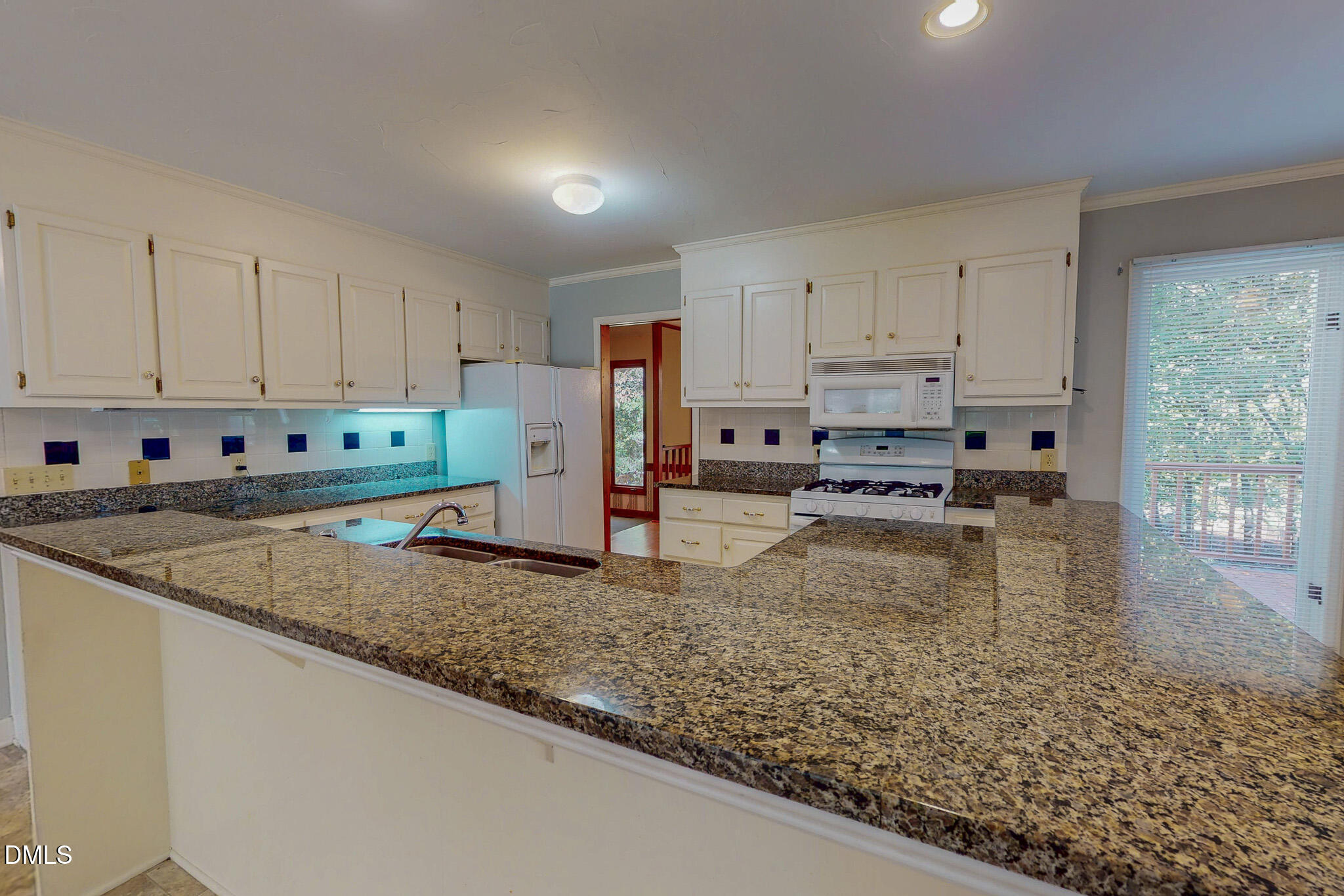 11 Denada Path Roxboro, NC 27574 - Photo 15 of 62 a kitchen with a stove a sink a counter top space and cabinets