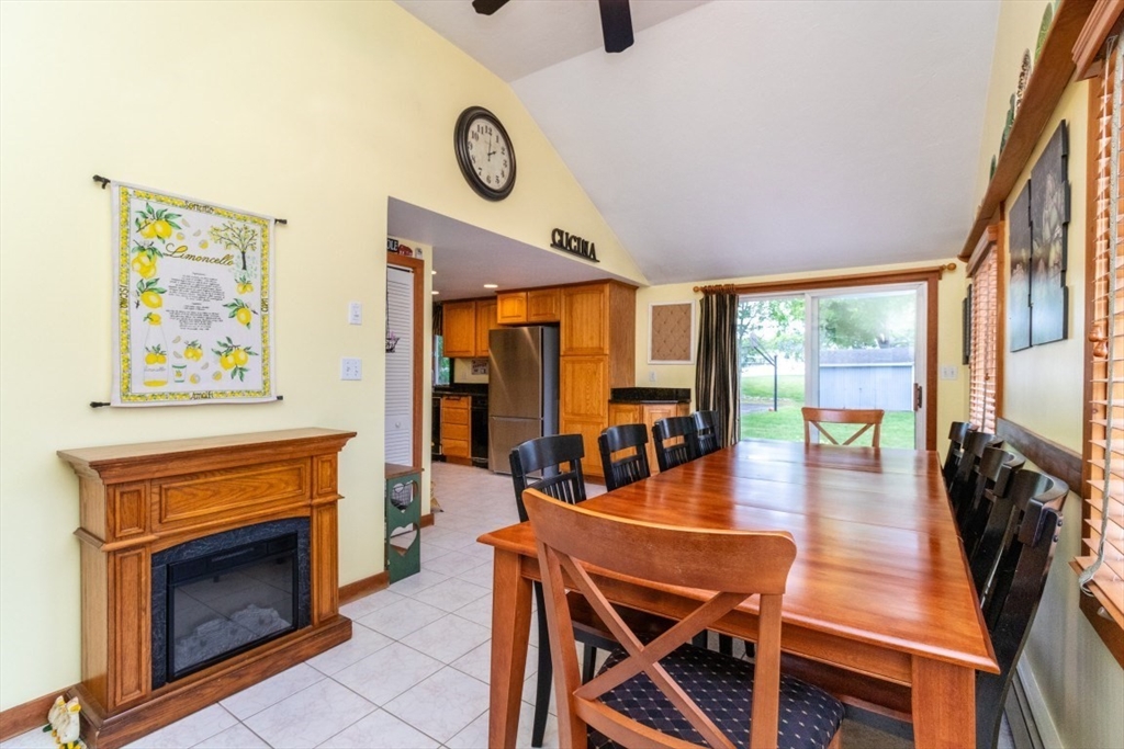 118 Bruce Road Walpole, MA 02081 - Photo 7 of 30 a dining room with furniture a fireplace and wooden floor