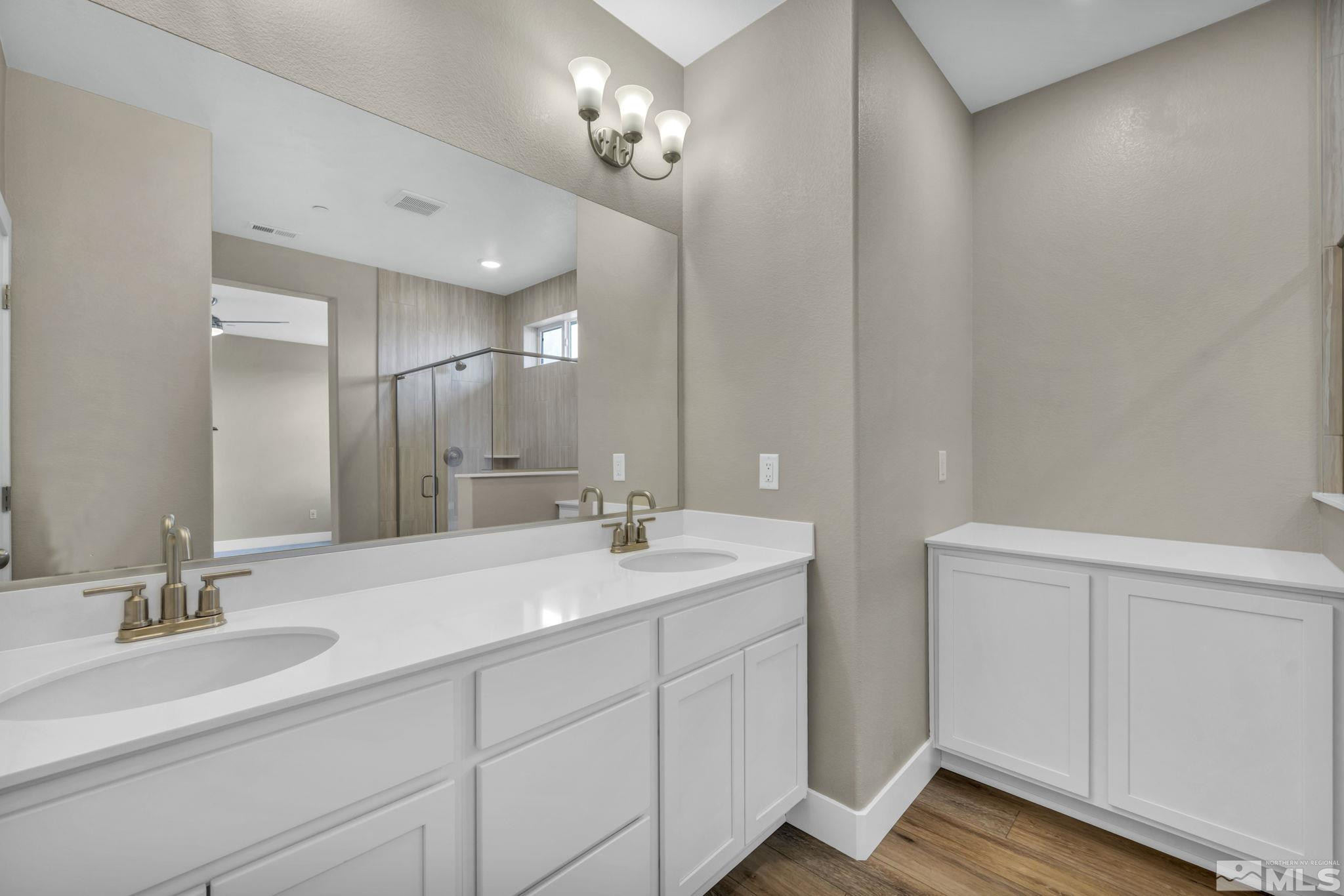 3660 Flare Lane, Unit 22 Carson City, NV 89705 - Photo 12 of 22 a bathroom with a double vanity sink and a mirror