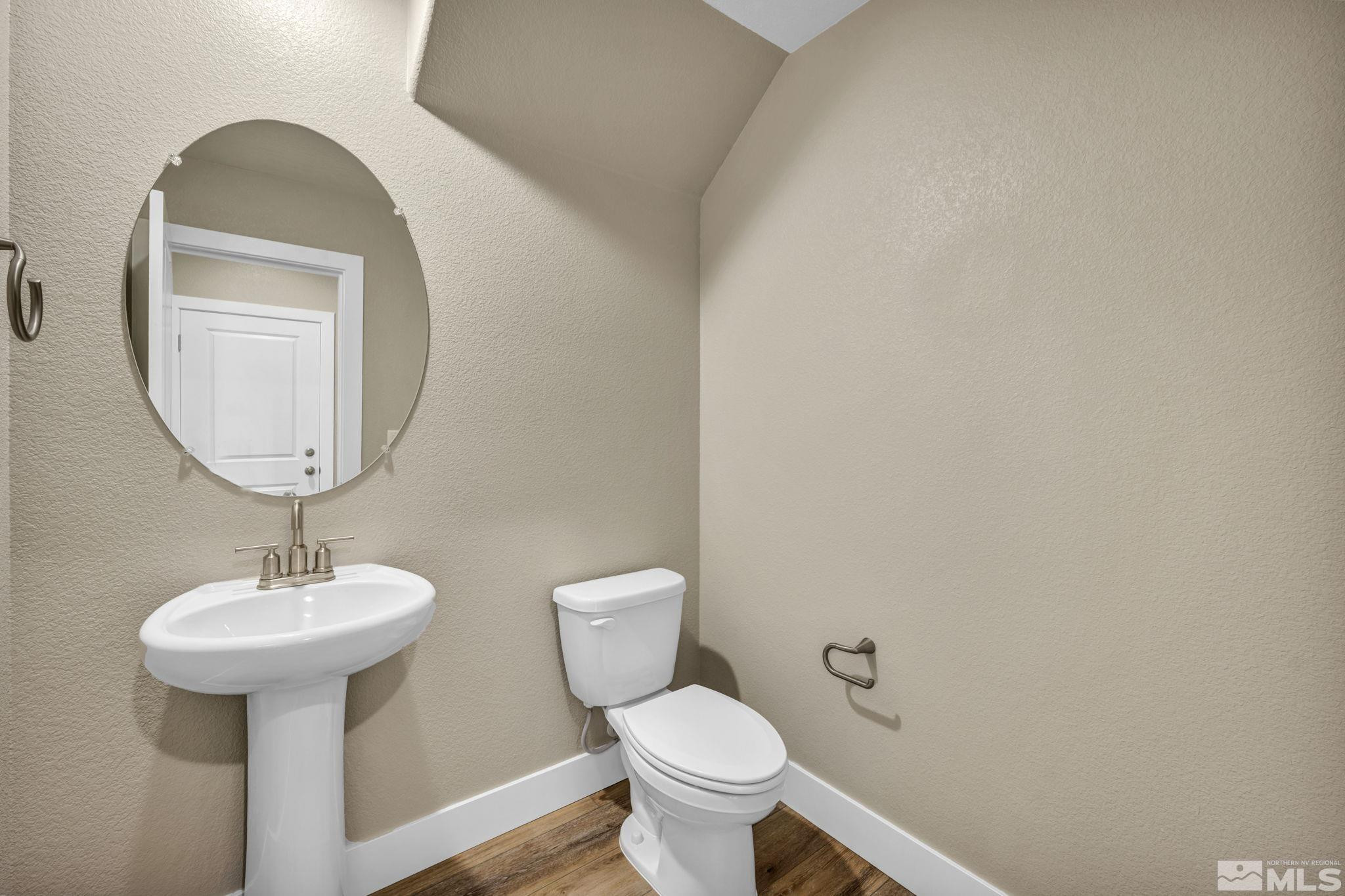 3660 Flare Lane, Unit 22 Carson City, NV 89705 - Photo 17 of 22 a bathroom with a toilet sink and mirror