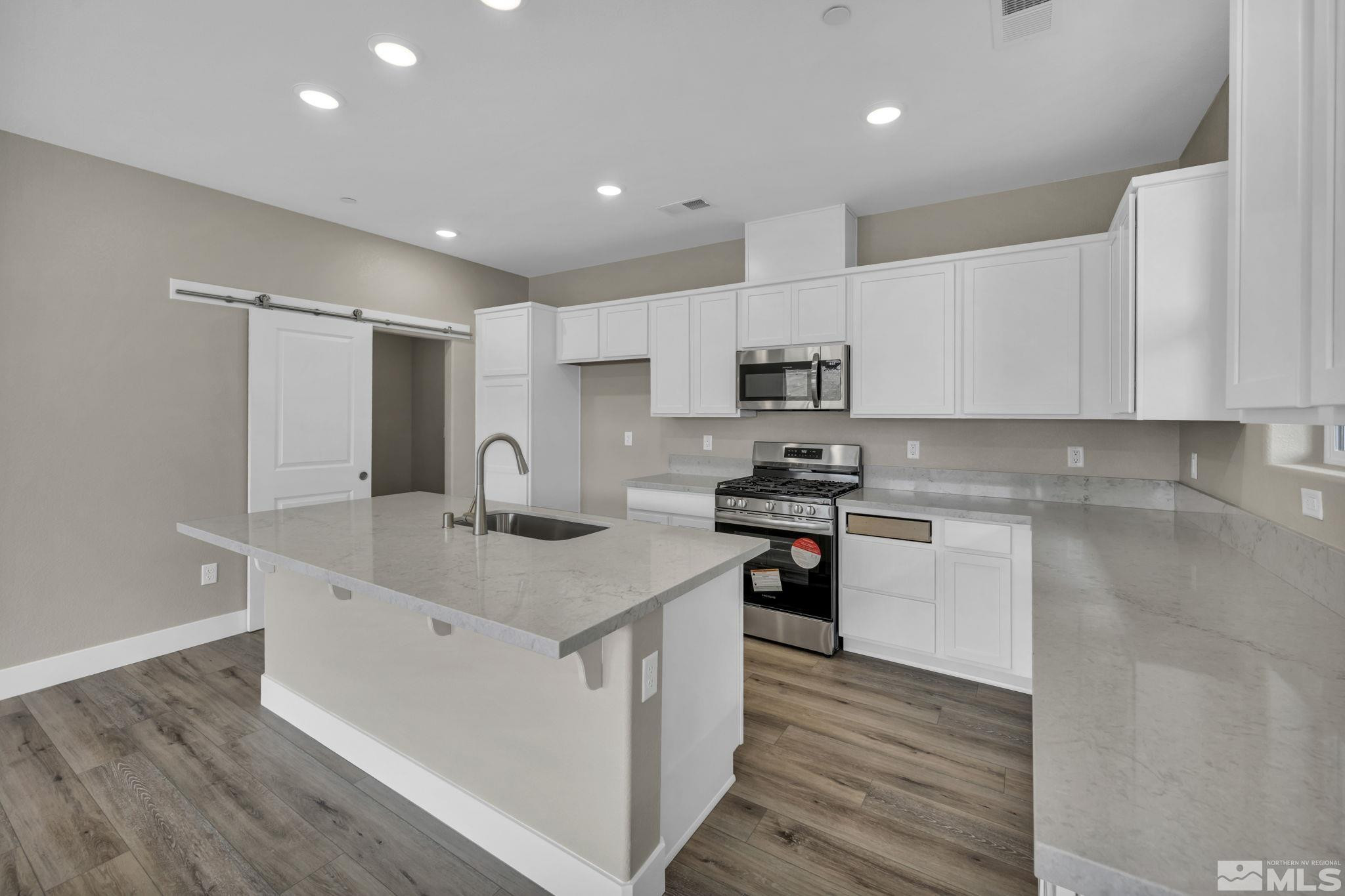 3660 Flare Lane, Unit 22 Carson City, NV 89705 - Photo 3 of 22 a kitchen with appliances a sink and cabinets