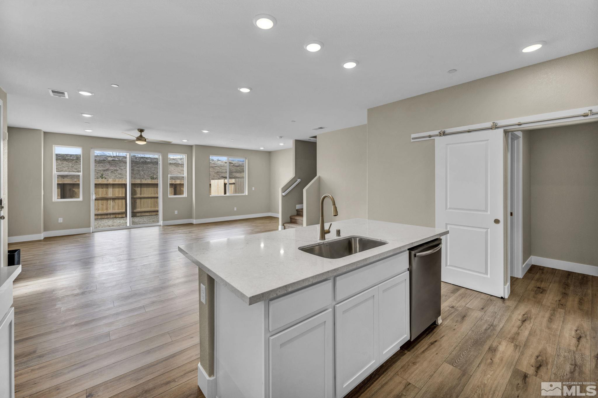 3660 Flare Lane, Unit 22 Carson City, NV 89705 - Photo 5 of 22 a kitchen with kitchen island a sink and wooden floor