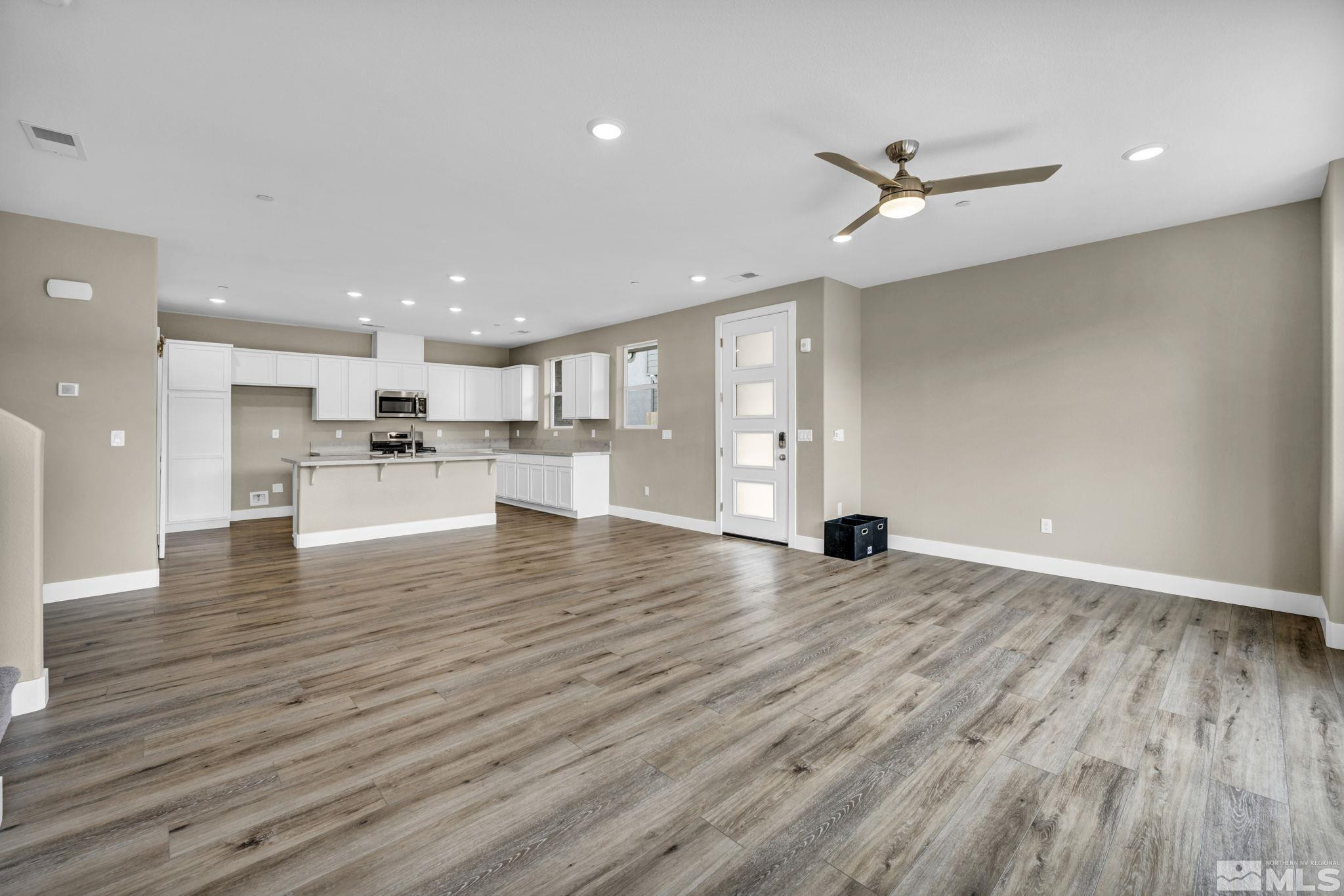 3660 Flare Lane, Unit 22 Carson City, NV 89705 - Photo 6 of 22 a view of a kitchen with a sink and wooden floor