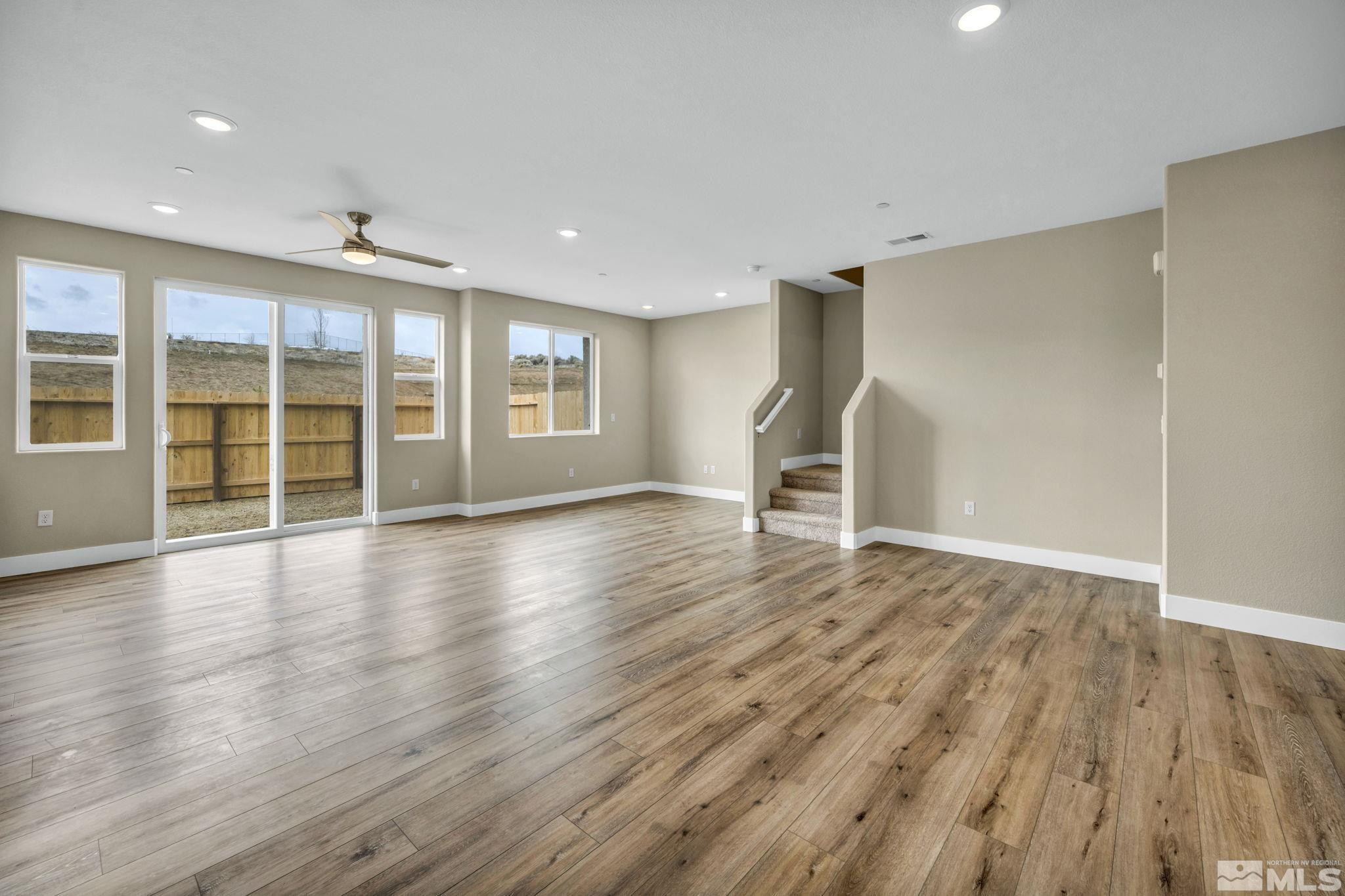 3660 Flare Lane, Unit 22 Carson City, NV 89705 - Photo 8 of 22 a view of empty room with wooden floor and fan