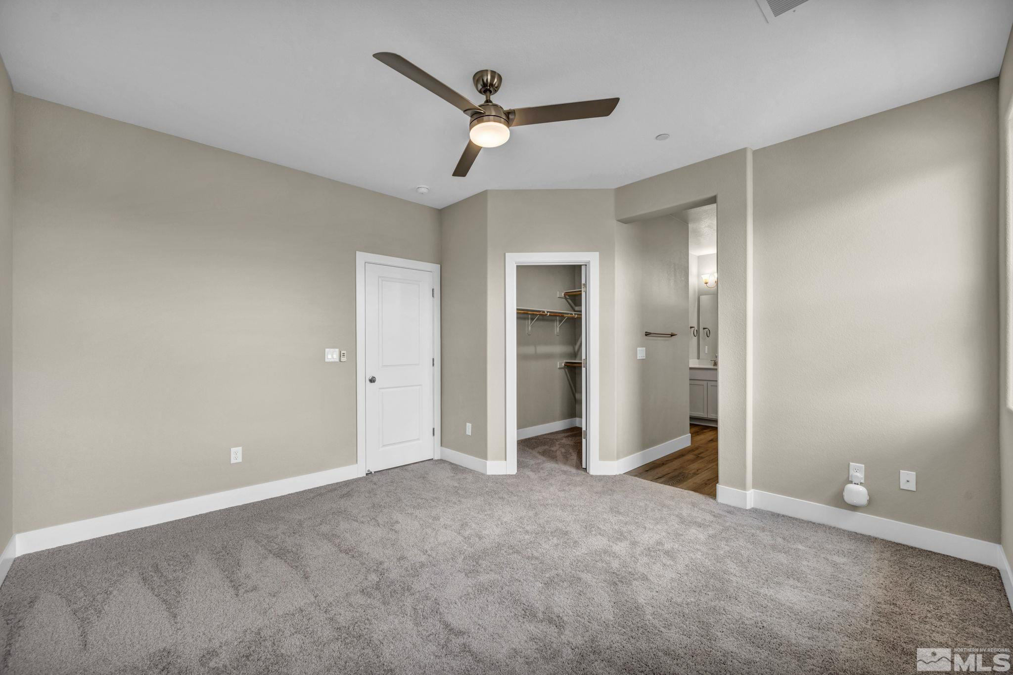 3660 Flare Lane, Unit 22 Carson City, NV 89705 - Photo 9 of 22 an empty room with closet and a ceiling fan