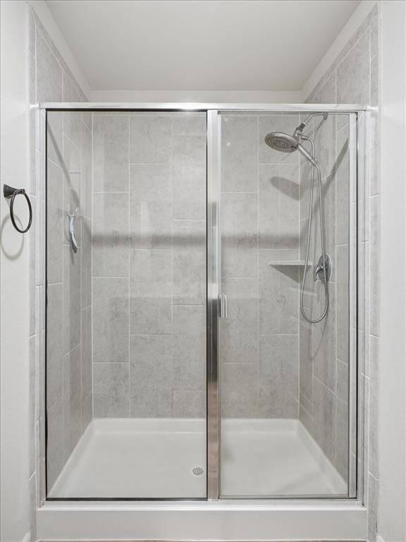 3083 Chillingham Drive Forney, TX 75126 - Photo 12 of 20 a bathroom with a shower