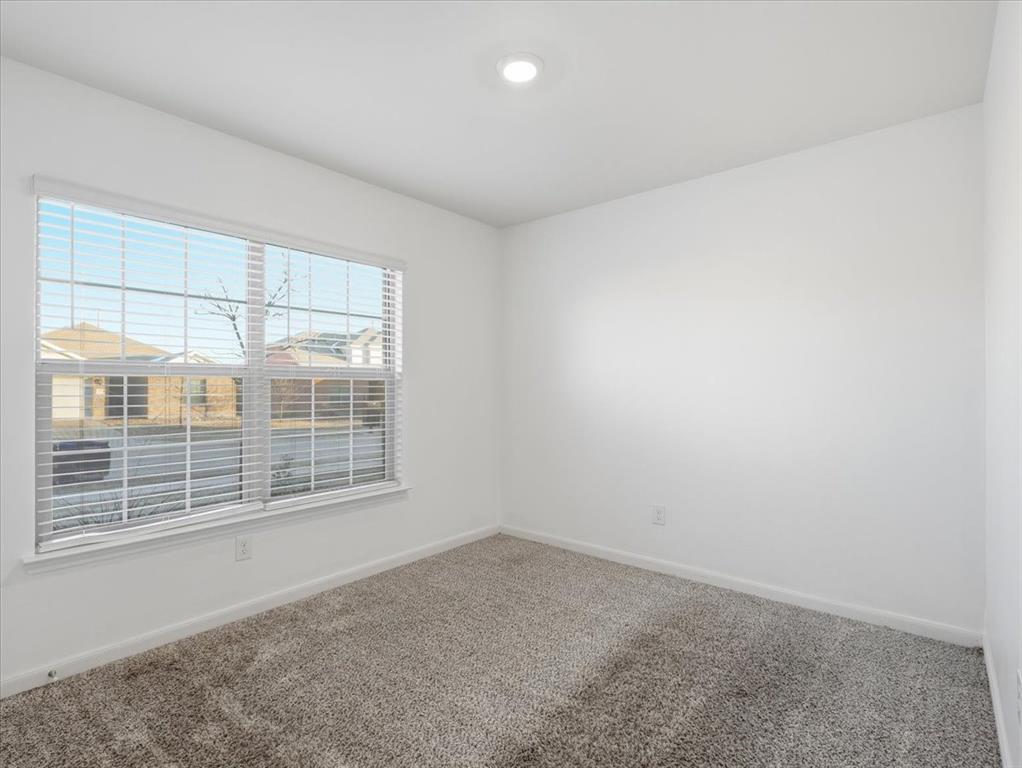 3083 Chillingham Drive Forney, TX 75126 - Photo 13 of 20 an empty room with windows