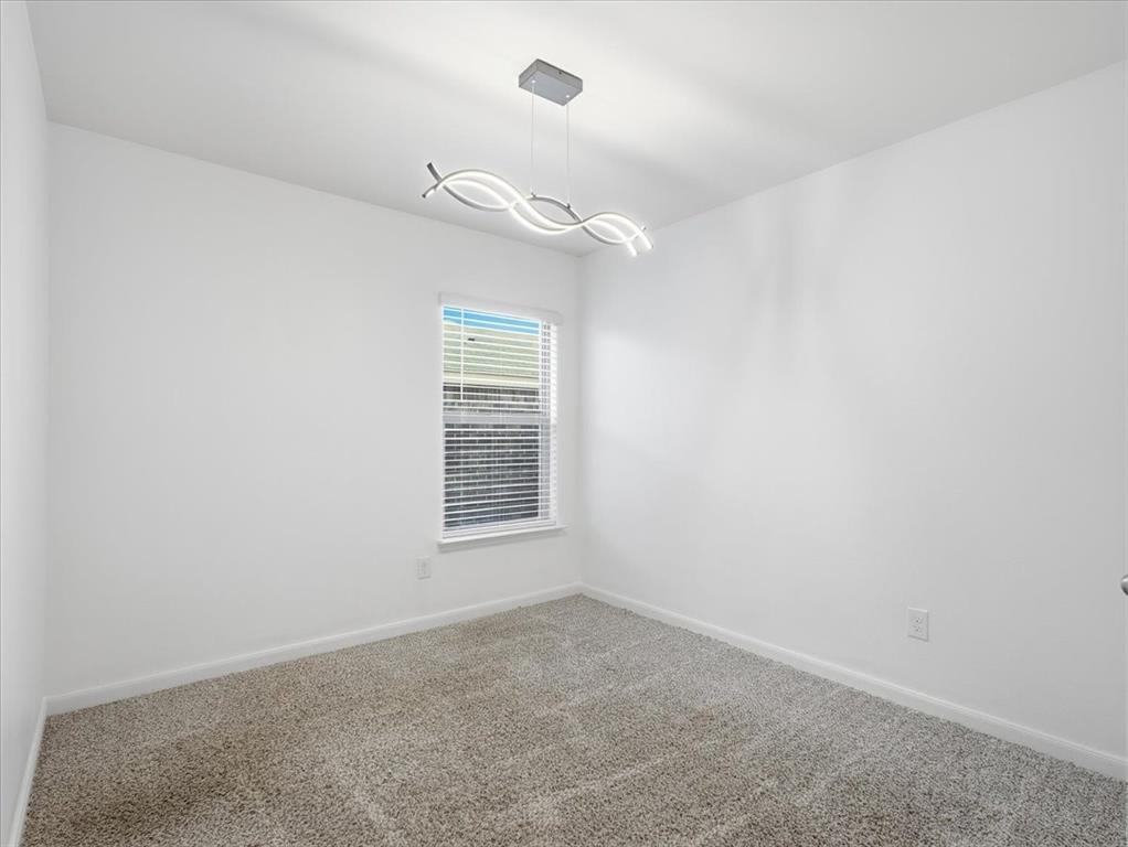 3083 Chillingham Drive Forney, TX 75126 - Photo 14 of 20 an empty room with windows