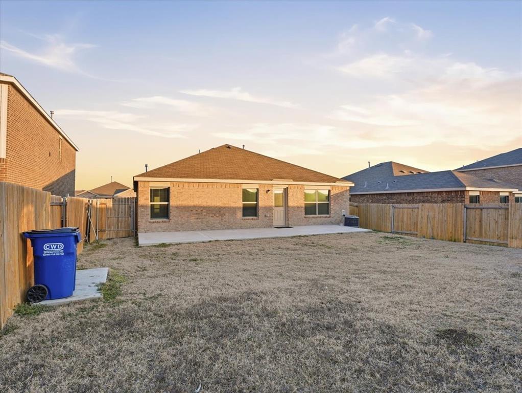 3083 Chillingham Drive Forney, TX 75126 - Photo 20 of 20 a view of a house with a yard and wooden fence
