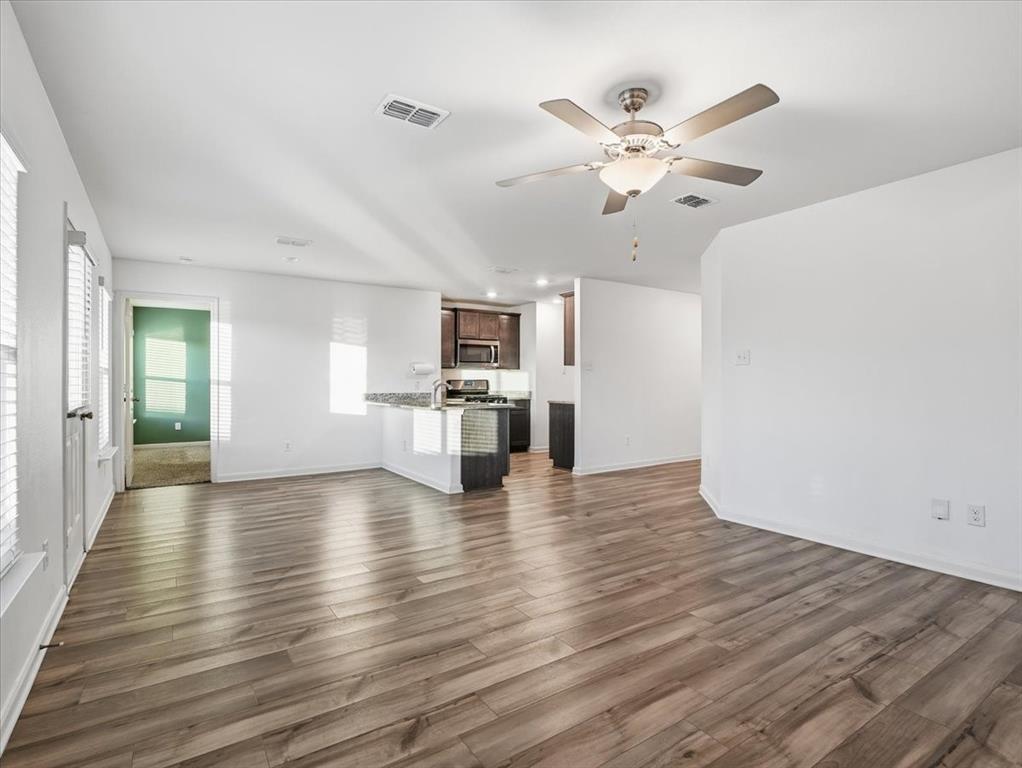 3083 Chillingham Drive Forney, TX 75126 - Photo 6 of 20 a view of kitchen with cabinets and wooden floor