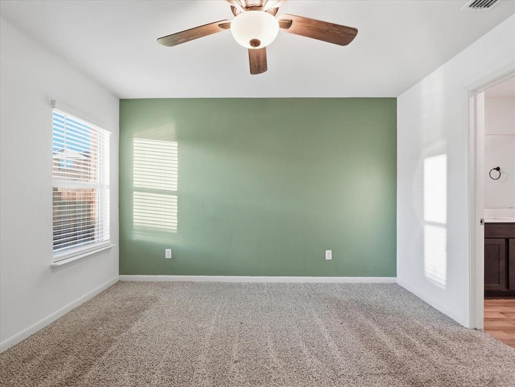 3083 Chillingham Drive Forney, TX 75126 - Photo 10 of 20 a view of an empty room with window and cabinet