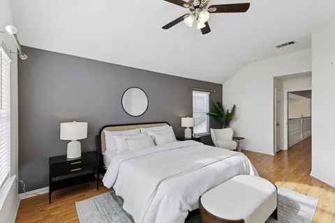 a bedroom with a bed and a dresser