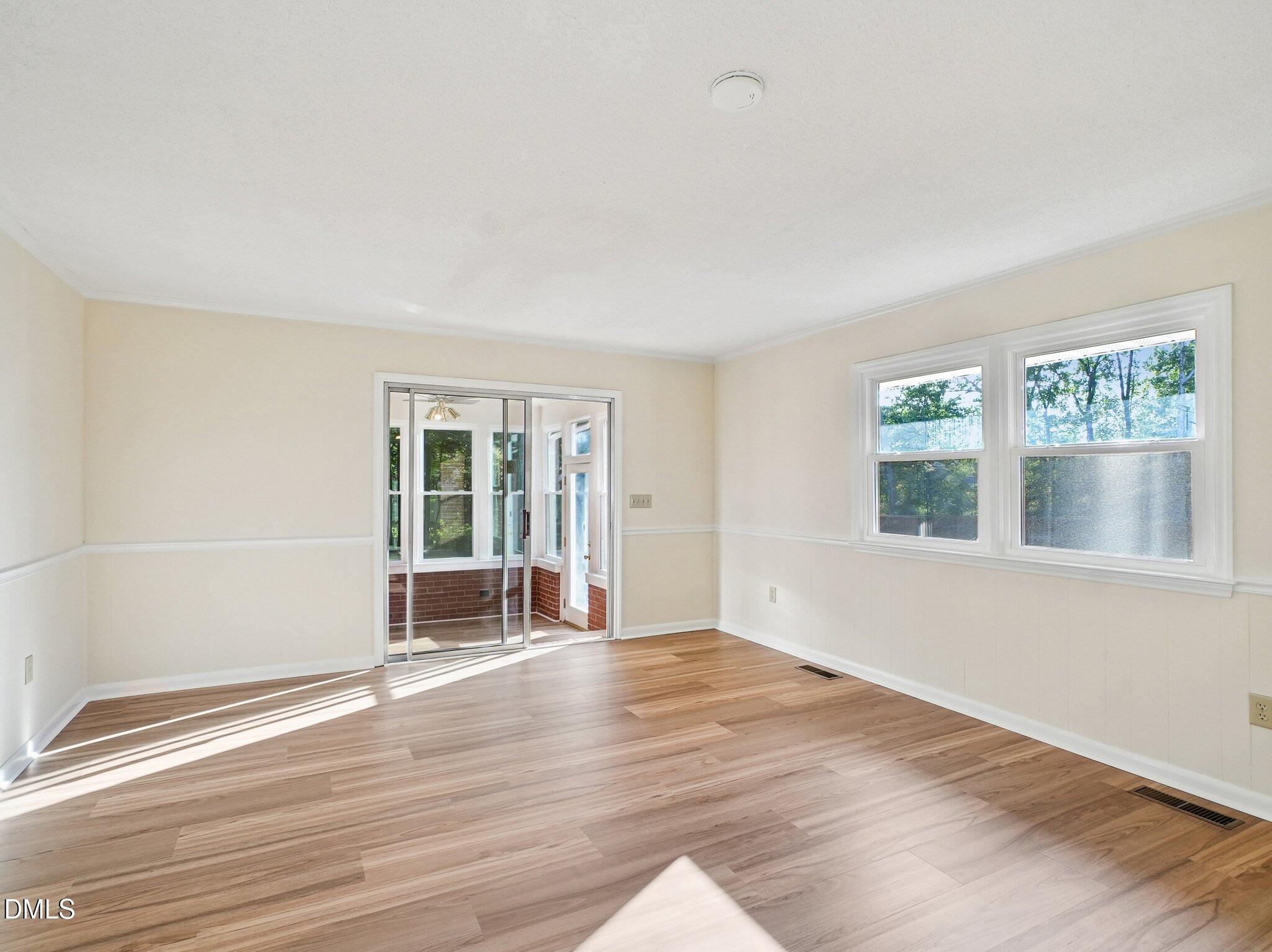 6421 King Lawrence Road Raleigh, NC 27607 - Photo 40 of 52 family room to sun room